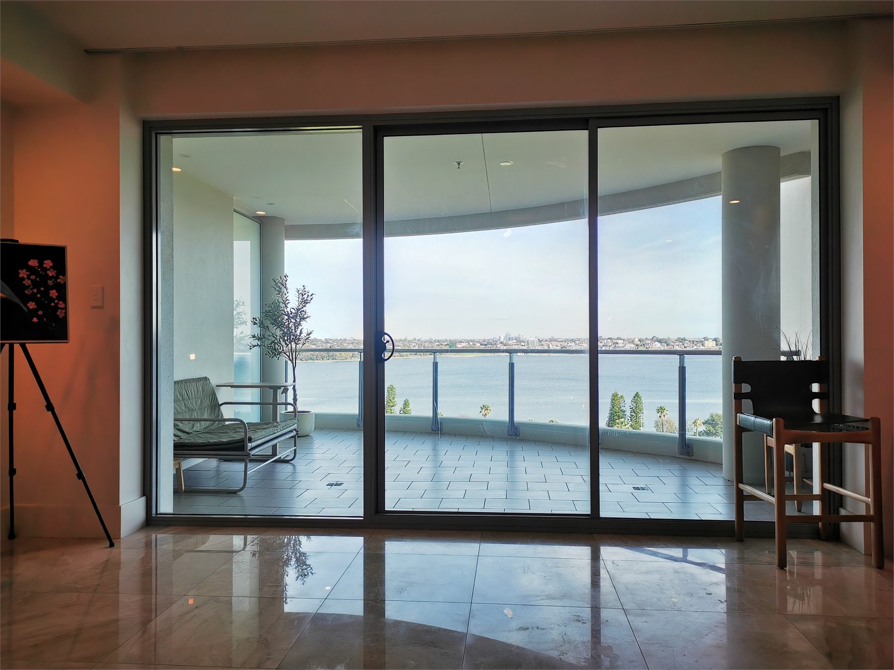 The living-room balcony opening before the sheer curtains were installed.