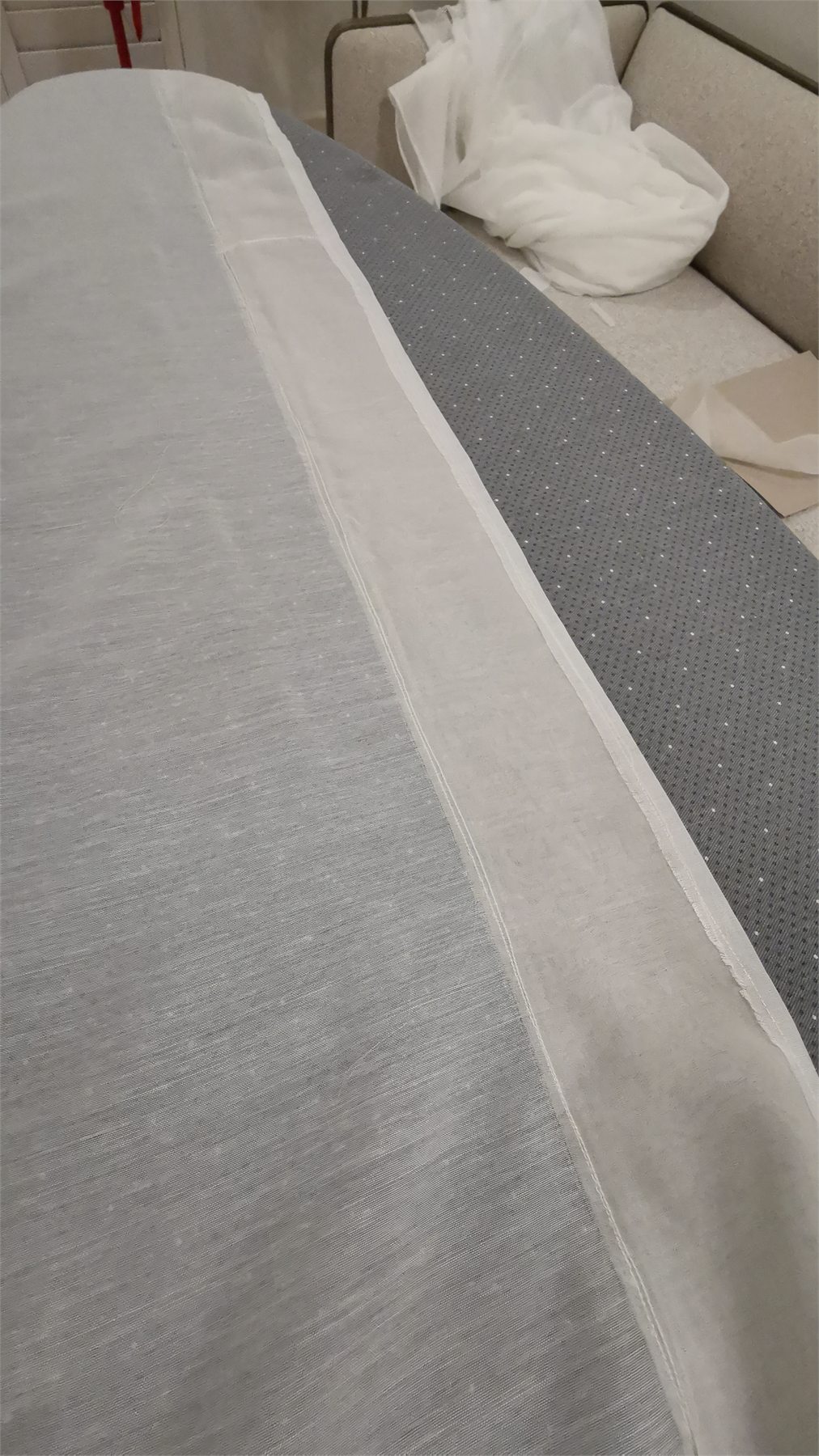 Wide sheer fabric laid out during construction.