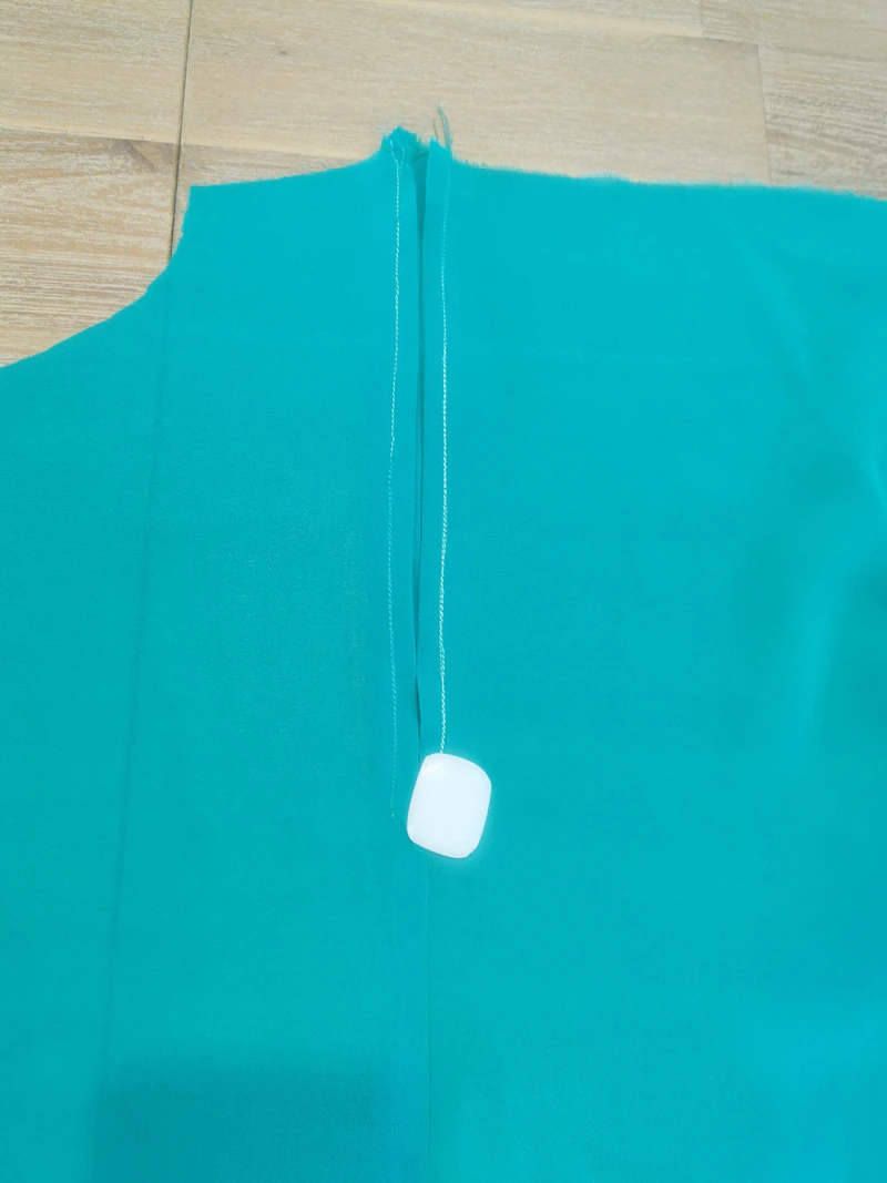 Two rows of topstitching along the separate folded edges.