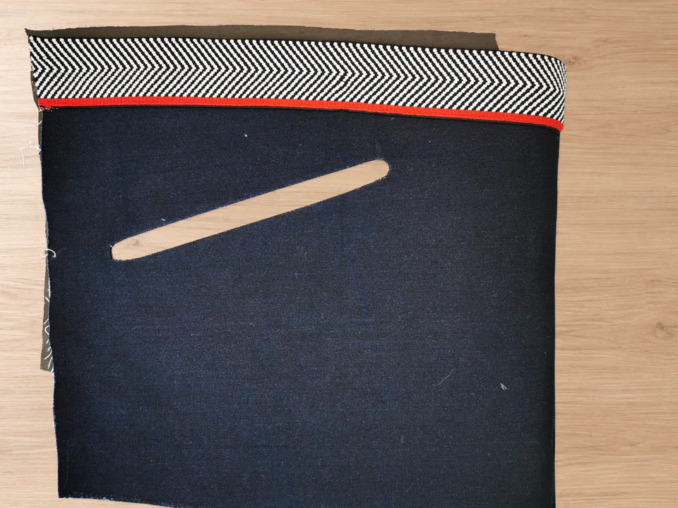 Navy right side of the trouser panel with a smooth empty rounded opening.